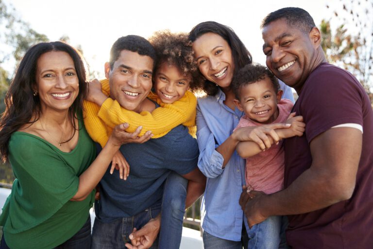 Mixed race three generation family playing together